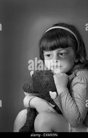 Portrait of young girl with a bruise or black eye on her left side, . This is a model, model released. Vertical color photograph Stock Photo