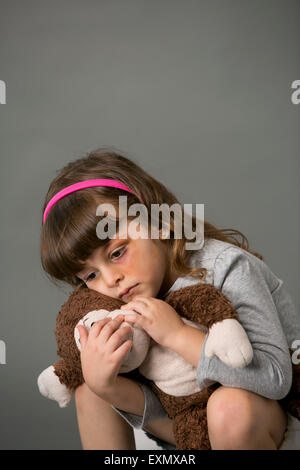 Portrait of young girl with a bruise or black eye on her left side, . This is a model, model released. Vertical color photograph Stock Photo