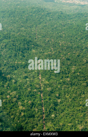 Para state, Brazil. Aerial view of dirt road through forest. Stock Photo