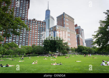 Park goers relax and sunbathe on the lawn at Hudson River Park in New York on a hot summer's Sunday, July 12, 2015. (© Richard B. Levine) Stock Photo