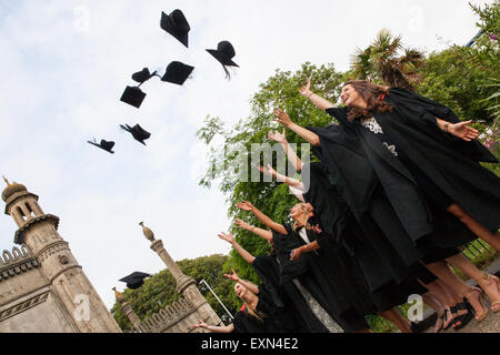 Brighton, Sussex, UK. 15th July, 2015. Sussex University students throw their mortar boards into the air to celebrate Graduation Day on Wednesday 15 July 2015 in Brighton, East Sussex, UK Credit:  DB Pictures/Alamy Live News Stock Photo