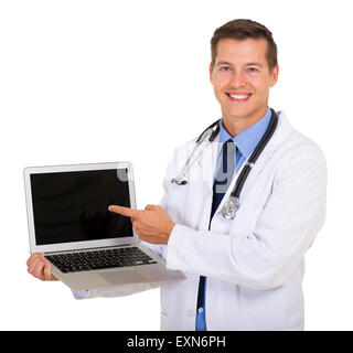 happy doctor pointing laptop screen on white background Stock Photo
