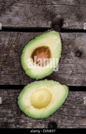 Sliced avocado on wood Stock Photo