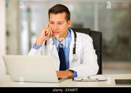 professional young medical doctor using laptop in office Stock Photo