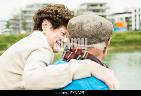 Happy senior woman watching her husband Stock Photo