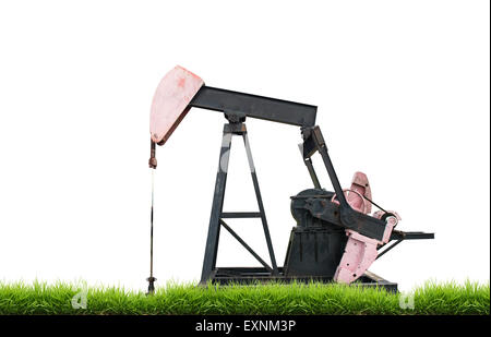 pumpjack with green grass isolated on white background Stock Photo