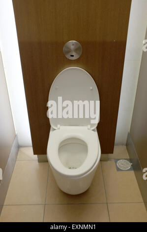 White toilet bowl in modern public rest room Stock Photo