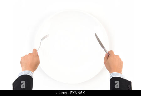 hand hold fork and knife with white plate on white background Stock Photo