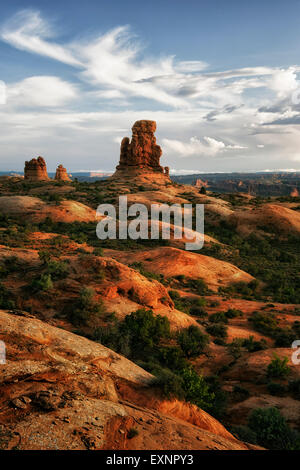 Late evening light on sandstone formations overlooking the Courthouse Towers in Utah’s Arches National Park. Stock Photo