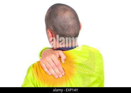 closeup of a young caucasian sportsman wearing sport clothes with his hand in his back because of his backache Stock Photo