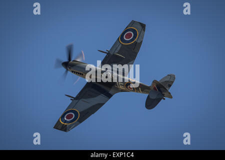 Single Spitfire flying against a blue sky, iconic image of the Battle ...