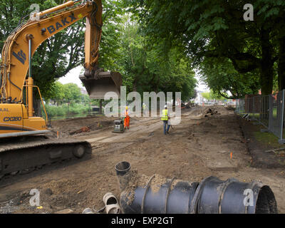 Workers rebuilding a road in the city centre of Breda, the Netherlands Stock Photo