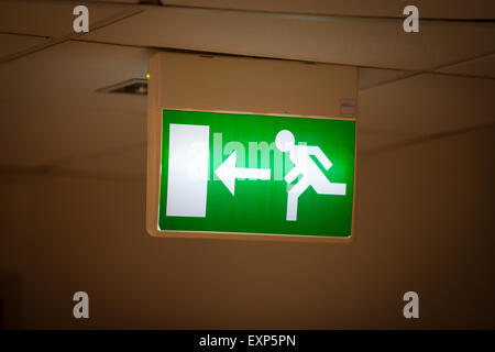 Emergency Exit Sign with Yellow Background Stock Photo