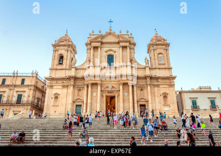 NOTO, ITALY - AUGUST 18, 2014: tourists in front of Baroque Cathedral in Noto, Sicily. Stock Photo
