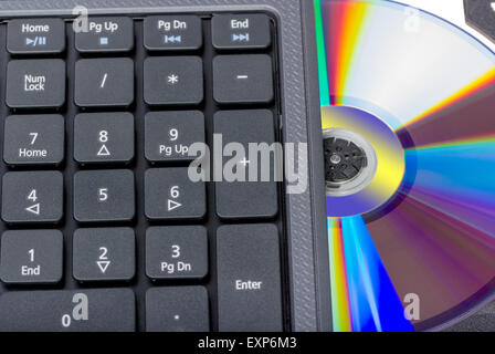 Electronic collection - Laptop with open DVD tray isolated on a white background Stock Photo