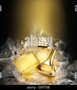 Fine fragrances in a concept gift set. Christmas fantasy environment. Stardust effect Stock Photo