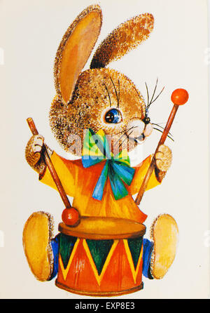 USSR - CIRCA 1989: Reproduction of antique postcard shows Bunny with drum. (painter L. Manilova) Stock Photo