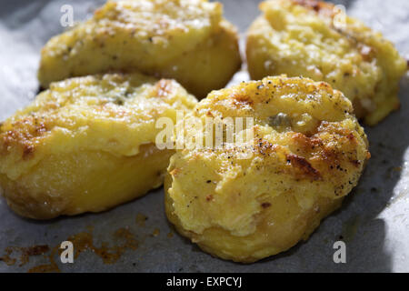 potatoes stuffed with pecorino cheese and gratinéed in oven Stock Photo