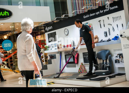 Dyson Roadshow Eldon Square Newcastle showing off and selling the new Dyson V6 vacuum cleaner that is as powerful as an upright Stock Photo