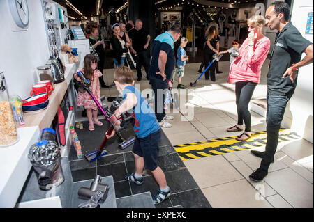 Dyson Roadshow Eldon Square Newcastle showing off and selling the new Dyson V6 vacuum cleaner that is as powerful as an upright Stock Photo