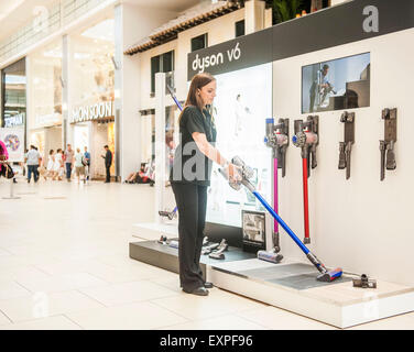 Dyson Roadshow Eldon Square Newcastle showing off and selling the new Dyson V6 vacuum cleaner that is as powerful as an upright Stock Photo