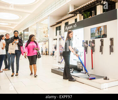 Dyson Roadshow Eldon Square Newcastle showing off and selling the new Dyson V6 vacuum cleaner that is as powerful as an upright Stock Photo