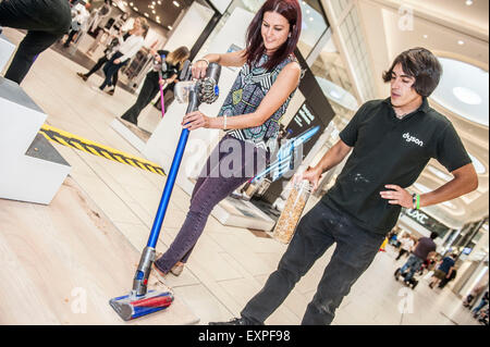 Dyson Roadshow Eldon Square Newcastle showing off and selling the new Dyson V6 vacuum cleaner that is as powerful as an upright Stock Photo