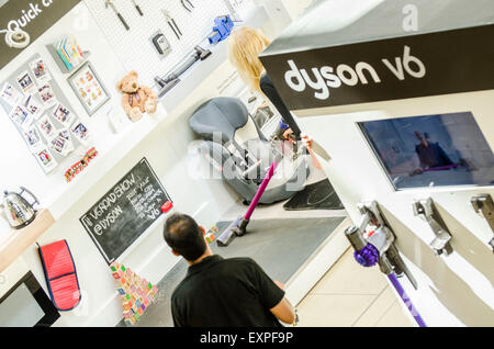 Dyson Roadshow Eldon Square Newcastle showing off and selling the new Dyson V6 vacuum cleaner that is as powerful as an upright Stock Photo