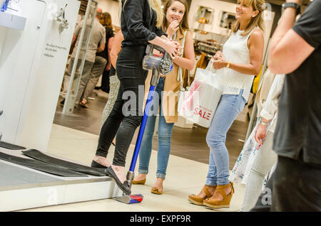 Dyson Roadshow Eldon Square Newcastle showing off and selling the new Dyson V6 vacuum cleaner that is as powerful as an upright Stock Photo