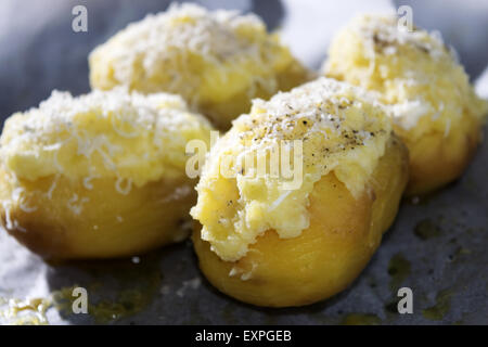 potatoes stuffed with pecorino cheese and gratinéed in oven Stock Photo