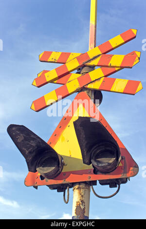 Railway sign and traffic lights at a railroad crossing Stock Photo