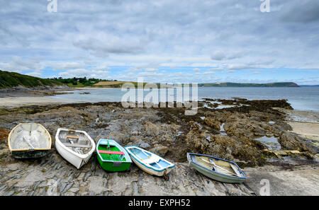 A row of rowing boats at Portscatho on the south coast of Cornwall Stock Photo