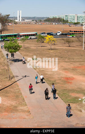 Brasilia, Brazil. People going to work  on path to Ministries and Congress buildings. Stock Photo