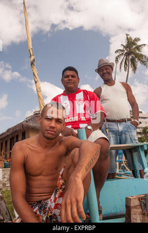 Maceio, Alagoas, State, Brazil. Ponta Verde beach. Three local fishermen. Stock Photo