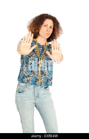 Beautiful woman doing different expressions in different sets of clothes: stop sign Stock Photo