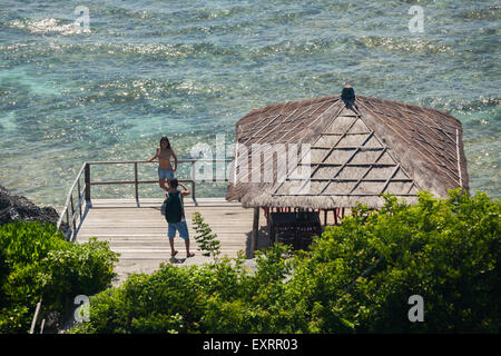 Tourists at viewing platform on Padang-padang beach in Labuan Sait, South Kuta, Badung, Bali, Indonesia. Stock Photo