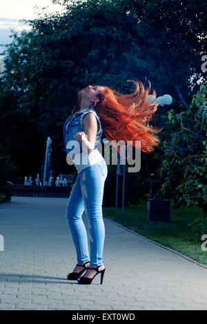 Full length portrait of red haired women shaking her head. Long Stock Photo