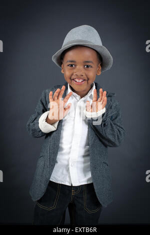 Handsome boy doing different expressions in different sets of clothes: innocent Stock Photo