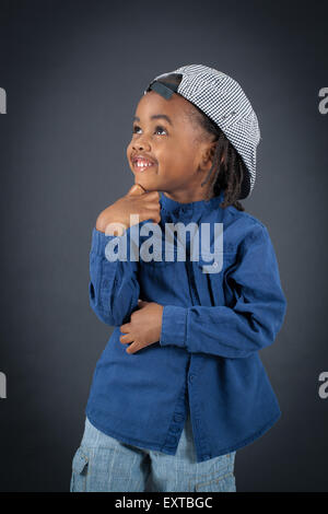 Handsome boy doing different expressions in different sets of clothes: thinking Stock Photo