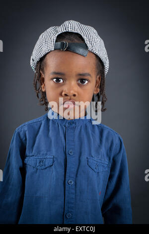 Handsome boy doing different expressions in different sets of clothes: thinking Stock Photo