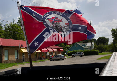 A confederate flag is seen flying off the bed of a pickup truck in Townsend, Tennessee. Stock Photo