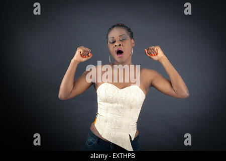 Beautiful woman doing different expressions in different sets of clothes: wake up Stock Photo