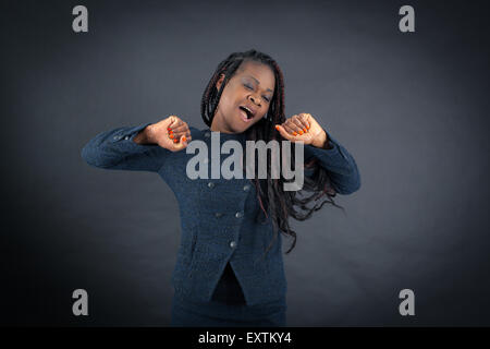 Beautiful woman doing different expressions in different sets of clothes: wake up Stock Photo