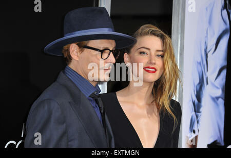 July 16, 2015 - File - Johnny Depp's wife, actress AMBER HEARD, has been charged with illegally smuggling dogs into Australia. Ms Heard came under fire for failing to declare Pistol and Boo, the couple's Yorkshire terriers, to authorities on their arrival in Brisbane in April. This week she was charged with two counts of illegally importing the dogs into Australia and one count of producing a false document. Penalties range from a hefty fine to more than 10 years in prison. Pictured: Feb. 12, 2014 - Los Angeles, California, U.S. - Johnny Depp and Amber Heard attending the premiere of '3 Days T Stock Photo