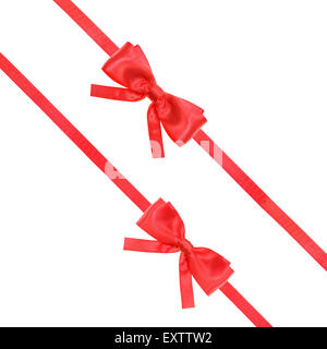two red satin bows and two diagonal ribbons isolated on square white background Stock Photo