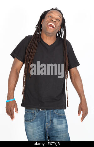 Young black man with dreadlocks laughing while holding his head ...