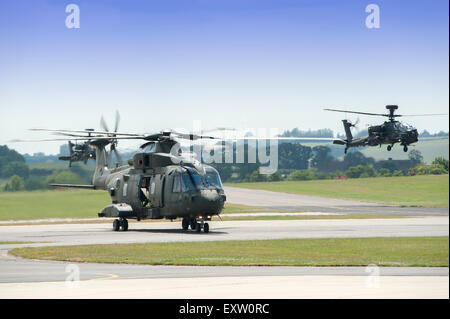 Royal Navy Merlin HC3 with Army Air Corps Apache AH1 Stock Photo