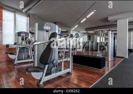 Empty gym interior with modern contemporary exercise machines equipment Stock Photo