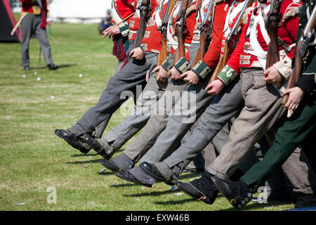 Military re-enactment enthusiasts parade in the red-coated uniform of British soldiers as worn between 1812 and 1816 Stock Photo
