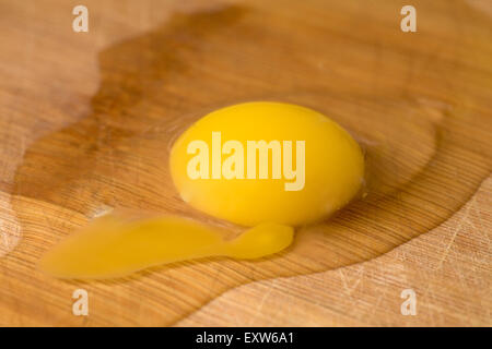 Brocken egg macro photograph on wood plank Stock Photo